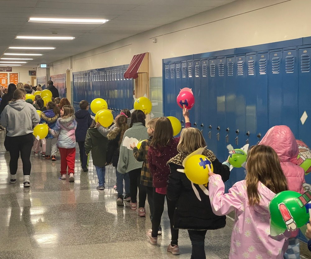 Students parade through hallways.