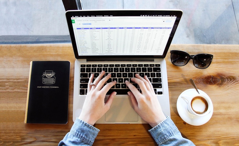 person typing on a computer