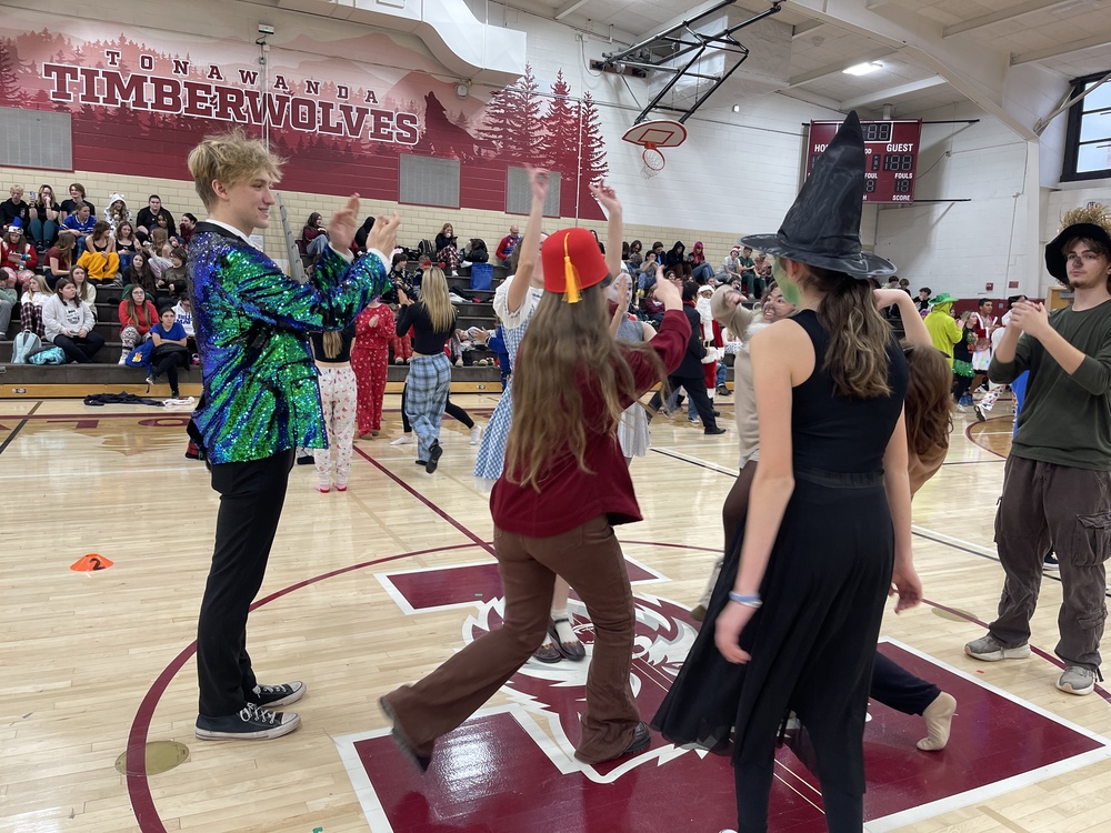 students dance in gym in square dance competition