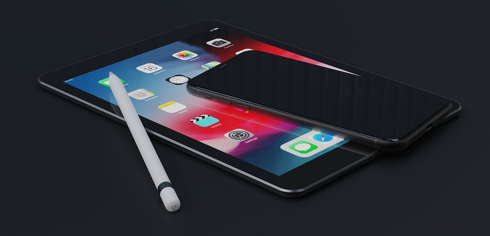 ipad and iphone laying on surface