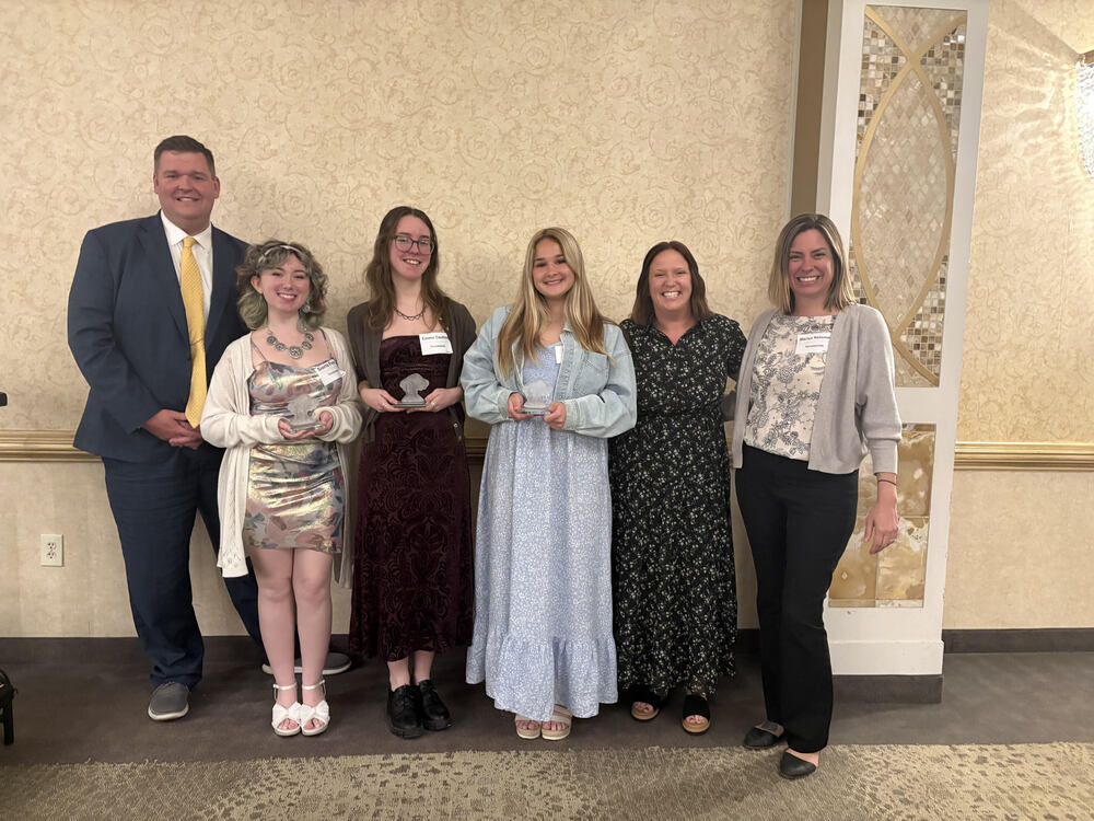 top three students pose with superintendent and principal