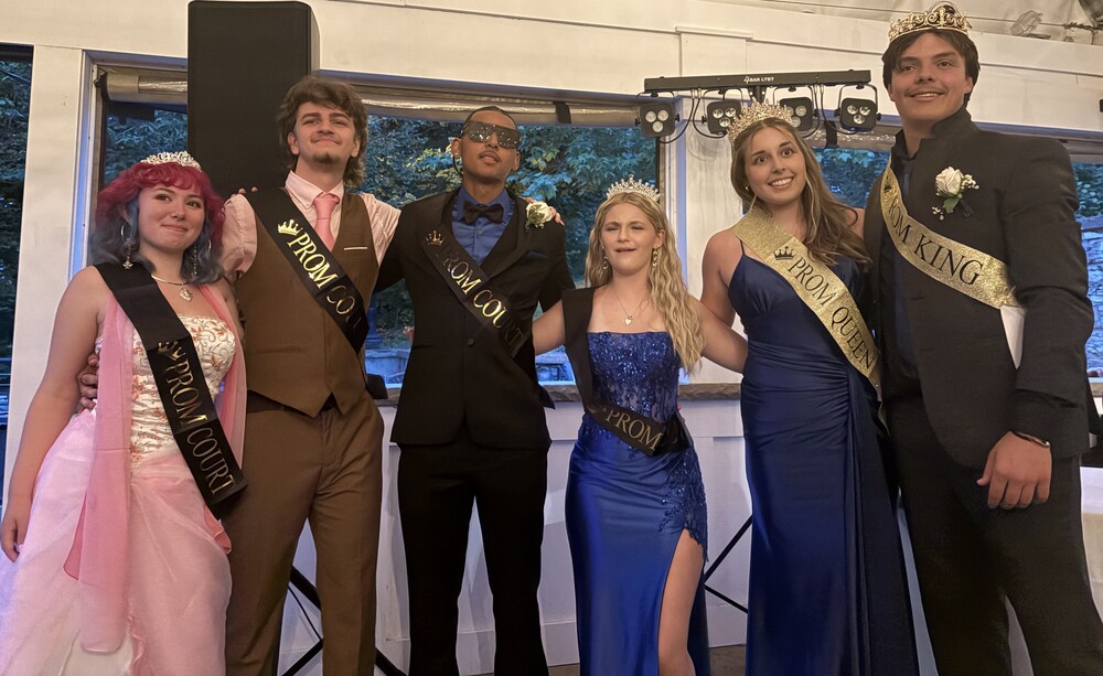 prom court poses with crowns and sashes