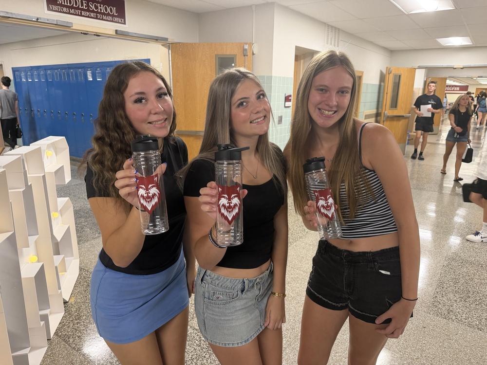 students show off new waterbottles