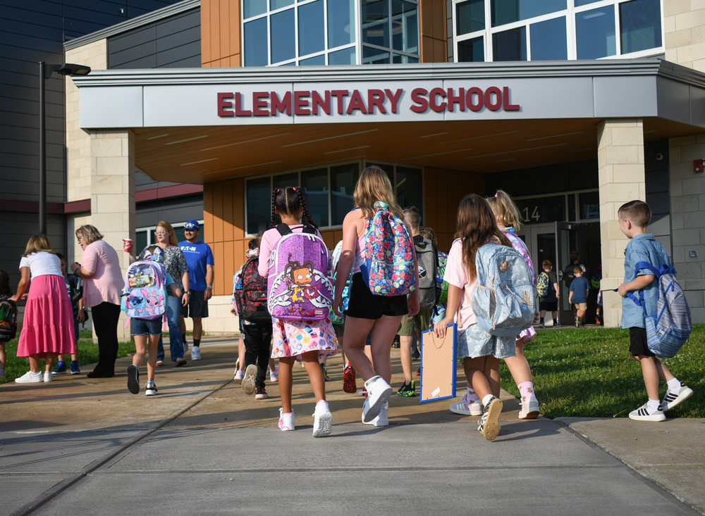 students walk into school for first day