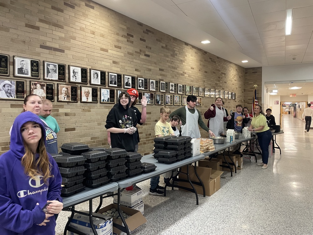 Students serve meals at Best Buddies Fish Fry.