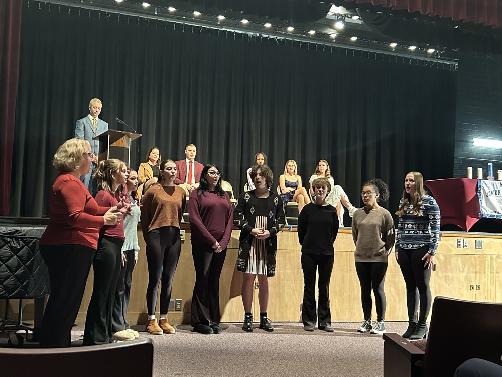 students singing at induction