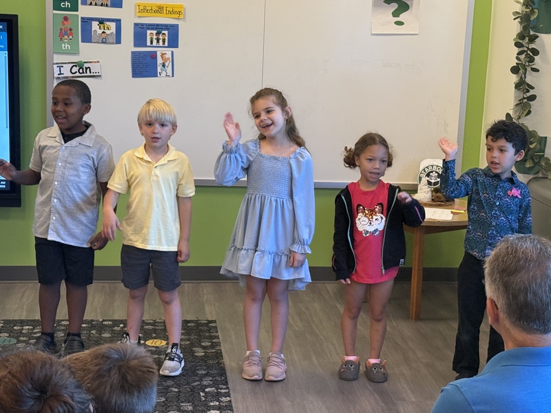 Students and families celebrate Kindergarten students. 
