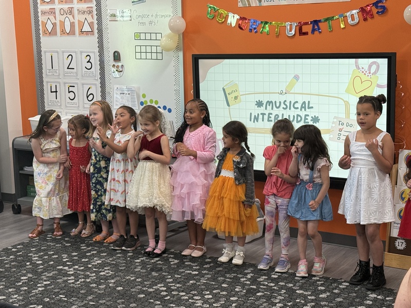 Students and families celebrate Kindergarten students. 