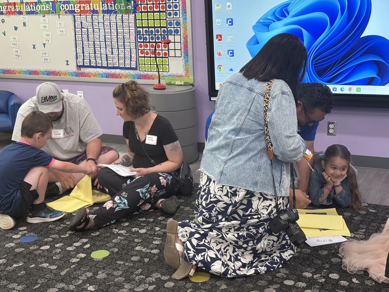 Students and families celebrate Kindergarten students. 