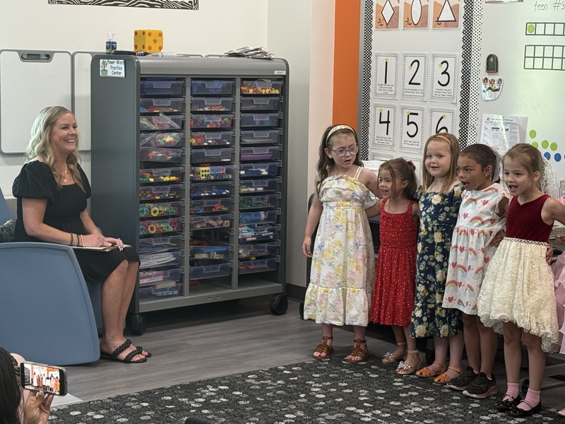 Students and families celebrate Kindergarten students. 