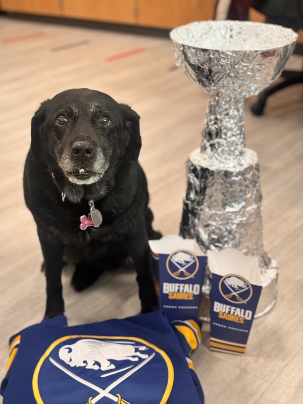storm poses with stanley cup replica and jersey