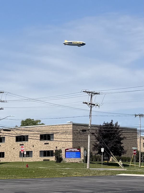 good year blimp flying over TMS/THS