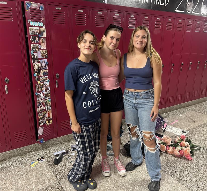 students pose with decorated locker