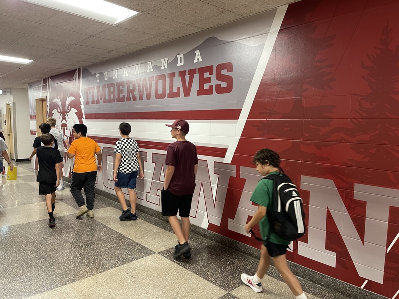 students walking through the school