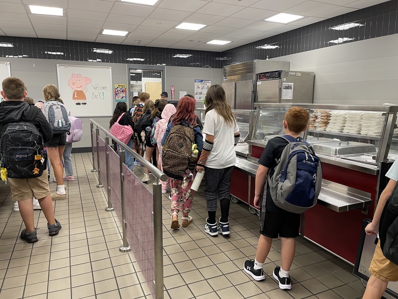students line up for breakfast