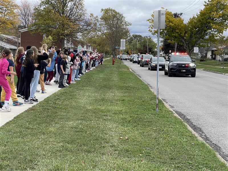 Cars participate in motorcade.