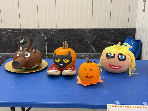 decorated pumpkins displayed on table