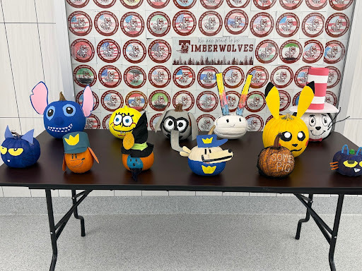 decorated pumpkins displayed on table