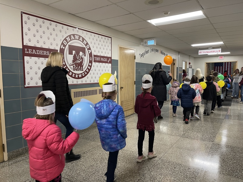 Students parade through hallways.