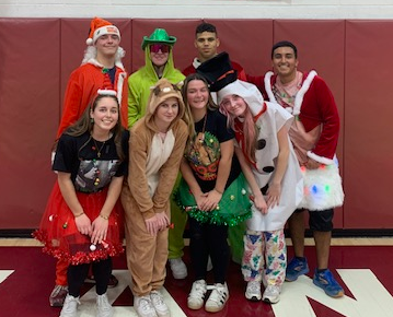 students pose in their christmas theme gear
