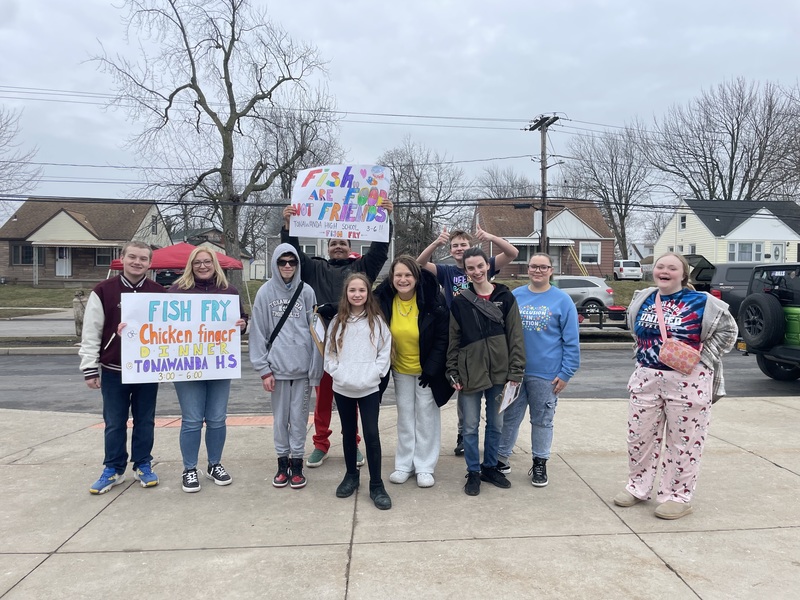 Students serve meals at Best Buddies Fish Fry.