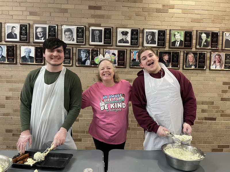 Students serve meals at Best Buddies Fish Fry.