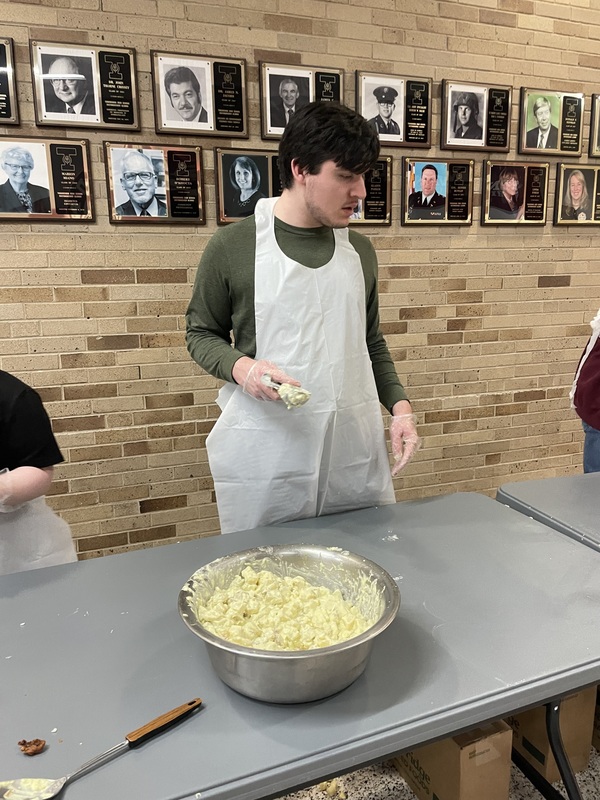 Students serve meals at Best Buddies Fish Fry.