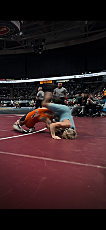 Anthony wrestles at a competition.