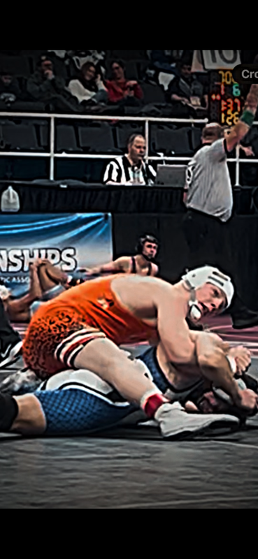 Anthony wrestles at a competition.