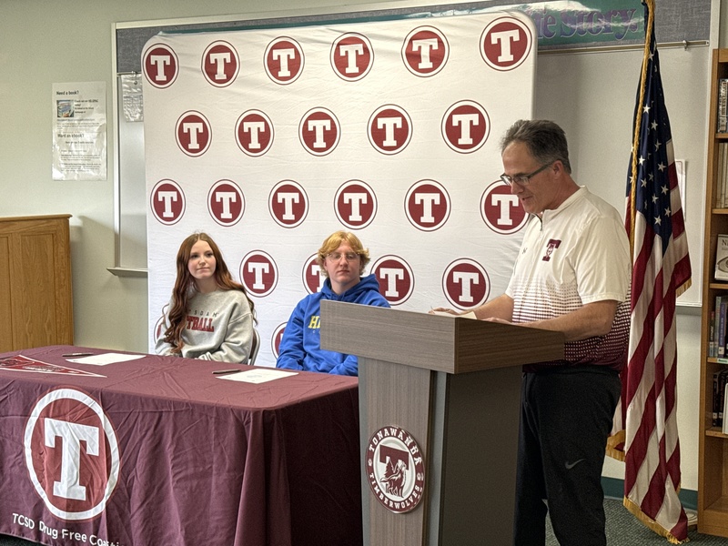 Samantha's coach speaks at the ceremony.