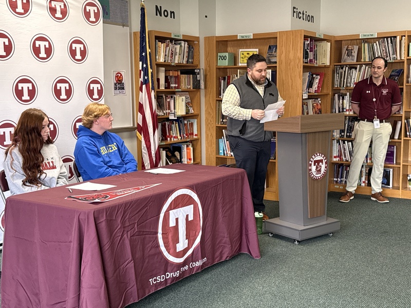 Josh's coach speaks at the ceremony.