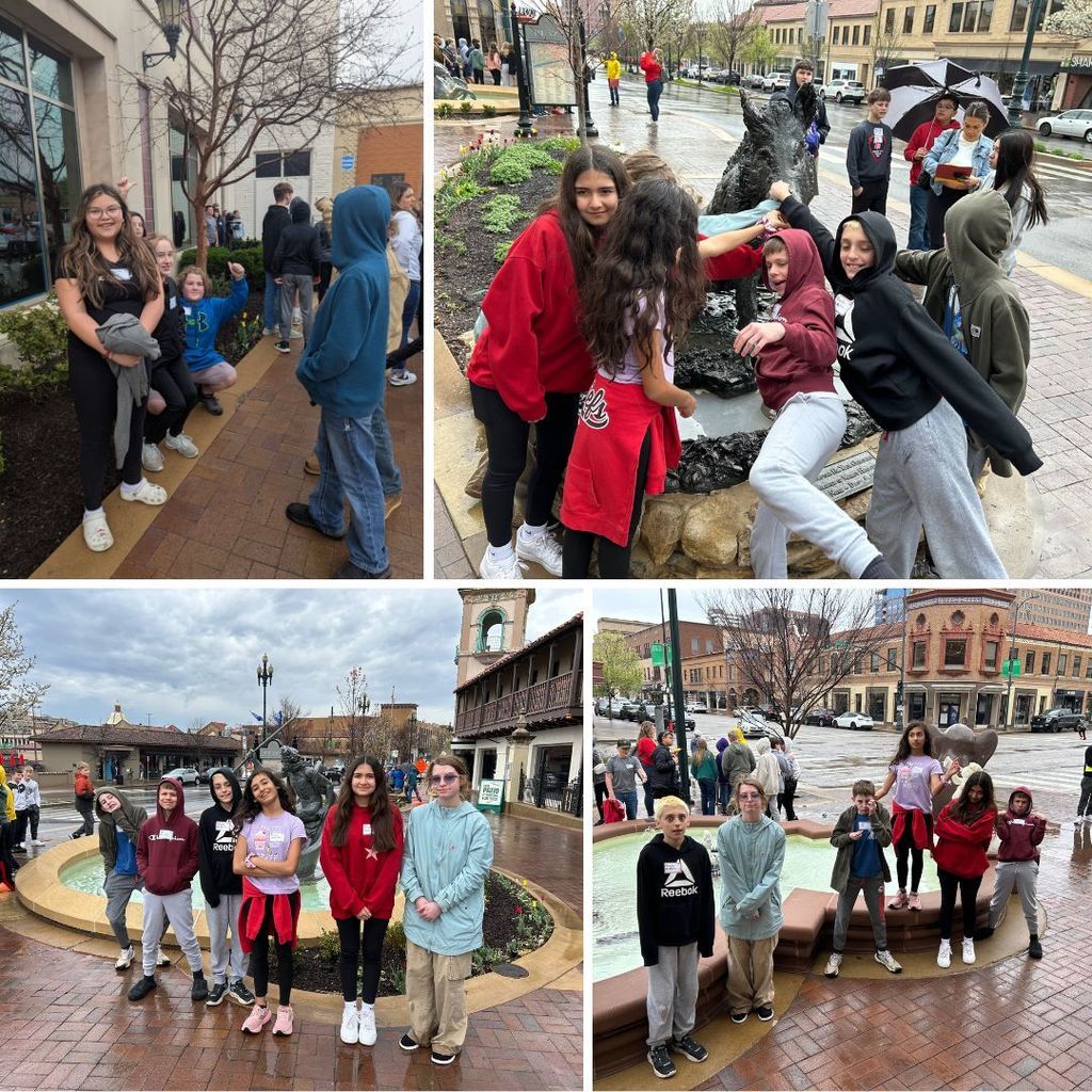 sixth graders standing in front of fountains on the plaza