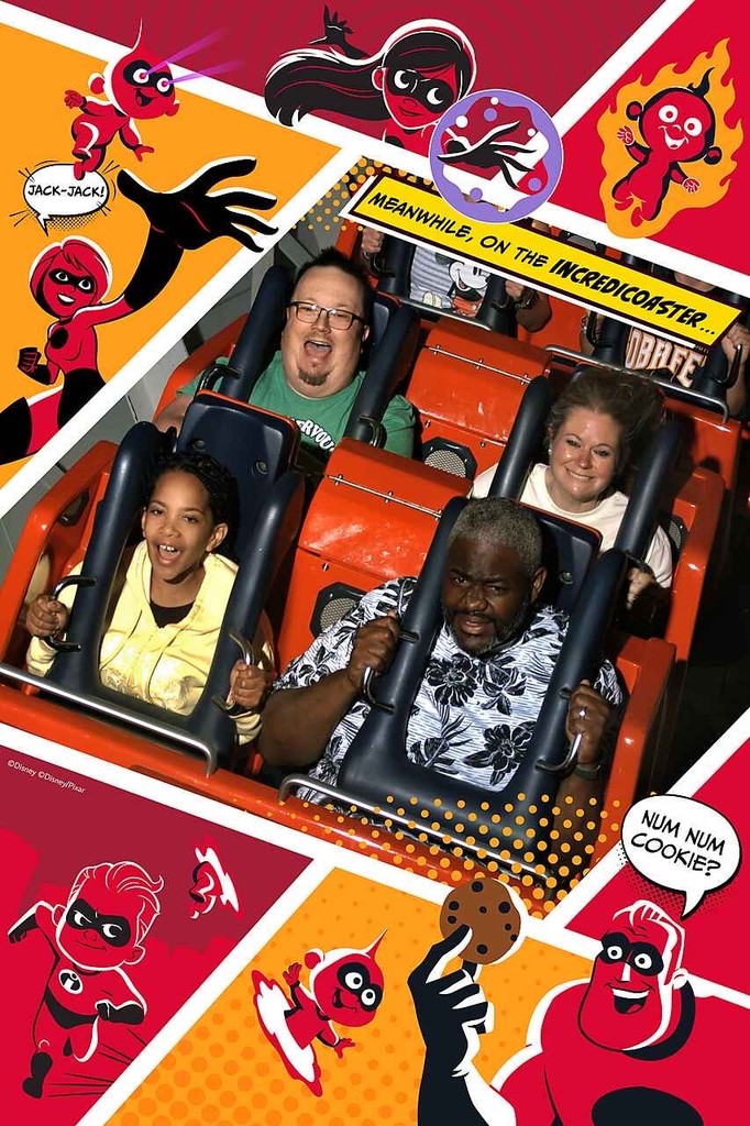 Josh and Amy Olsen riding a roller coaster, the black restraint bars over their shoulders