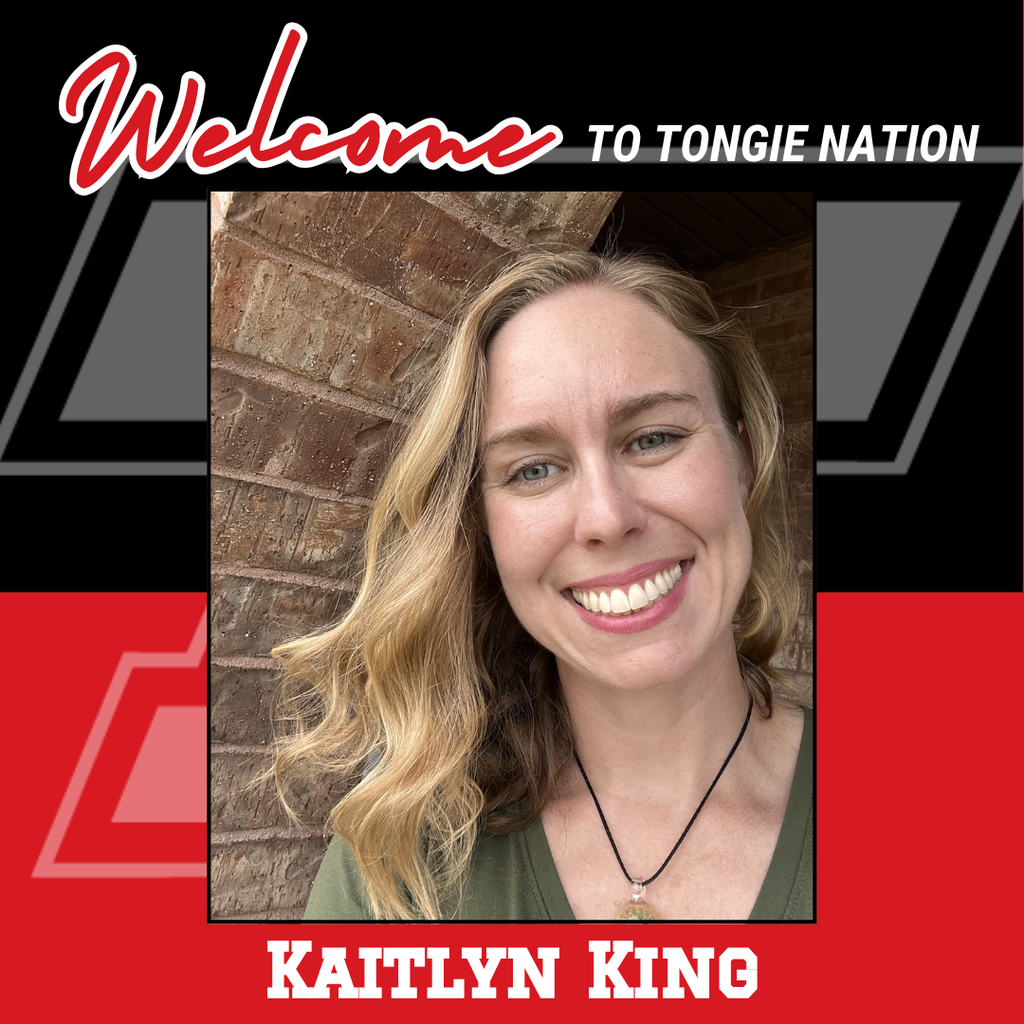 black and red background, headshot of kaitlyn wearing a green shirt and black necklace, her hair is down and slightly curled
