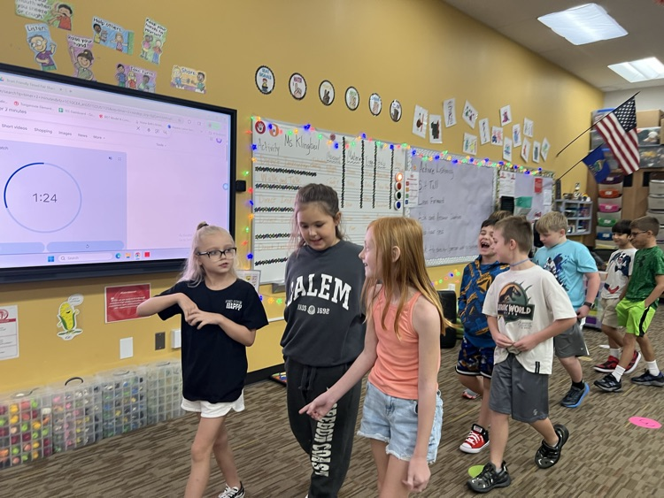 students talking in 3rd Meckler 