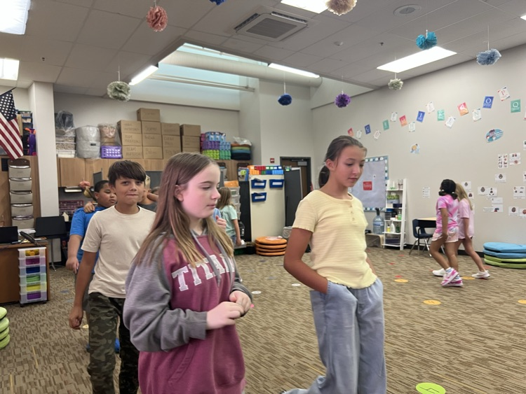 students walking and talking - Mrs. Schaecher 