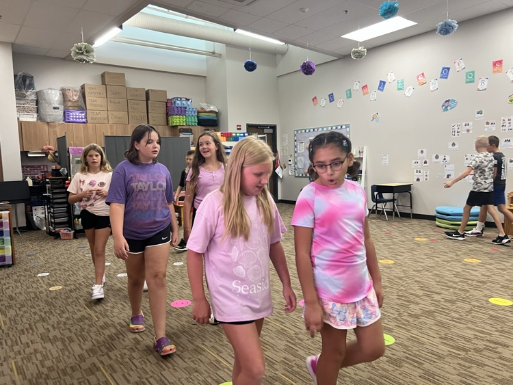 students walking and talking - Mrs. Schaecher 