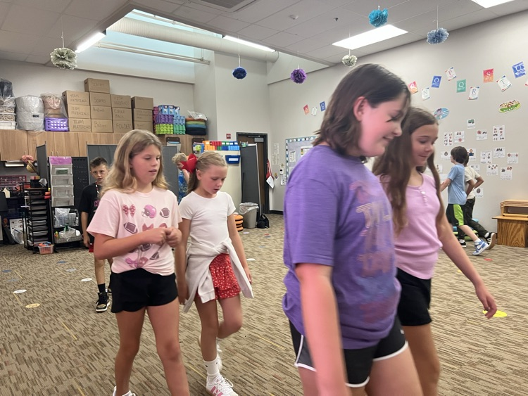 students walking and talking - Mrs. Schaecher 