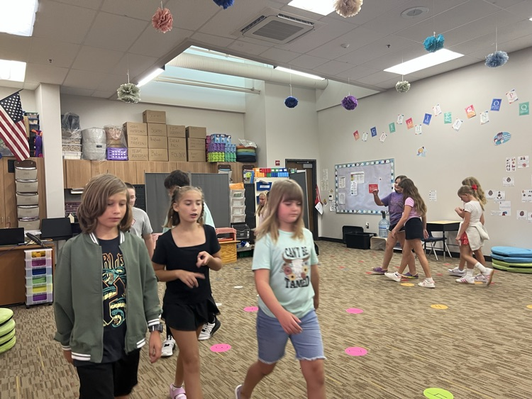 students walking and talking - Mrs. Schaecher 