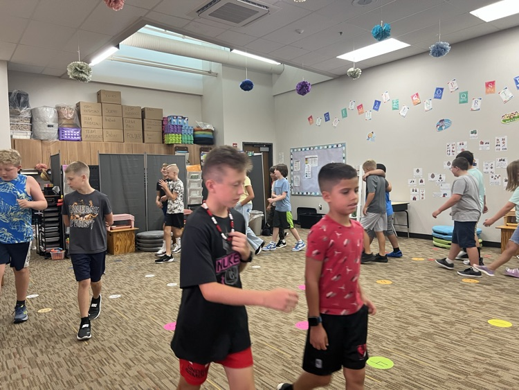 students walking and talking - Mrs. Schaecher 