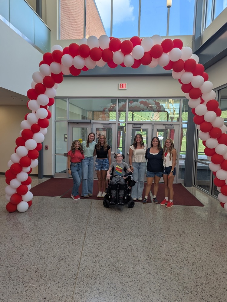 red and white balloon arches