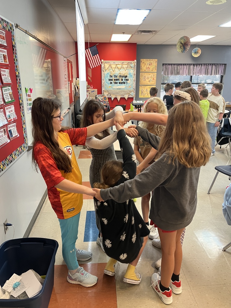 middle school boys and girls untangling themselves from a human knot