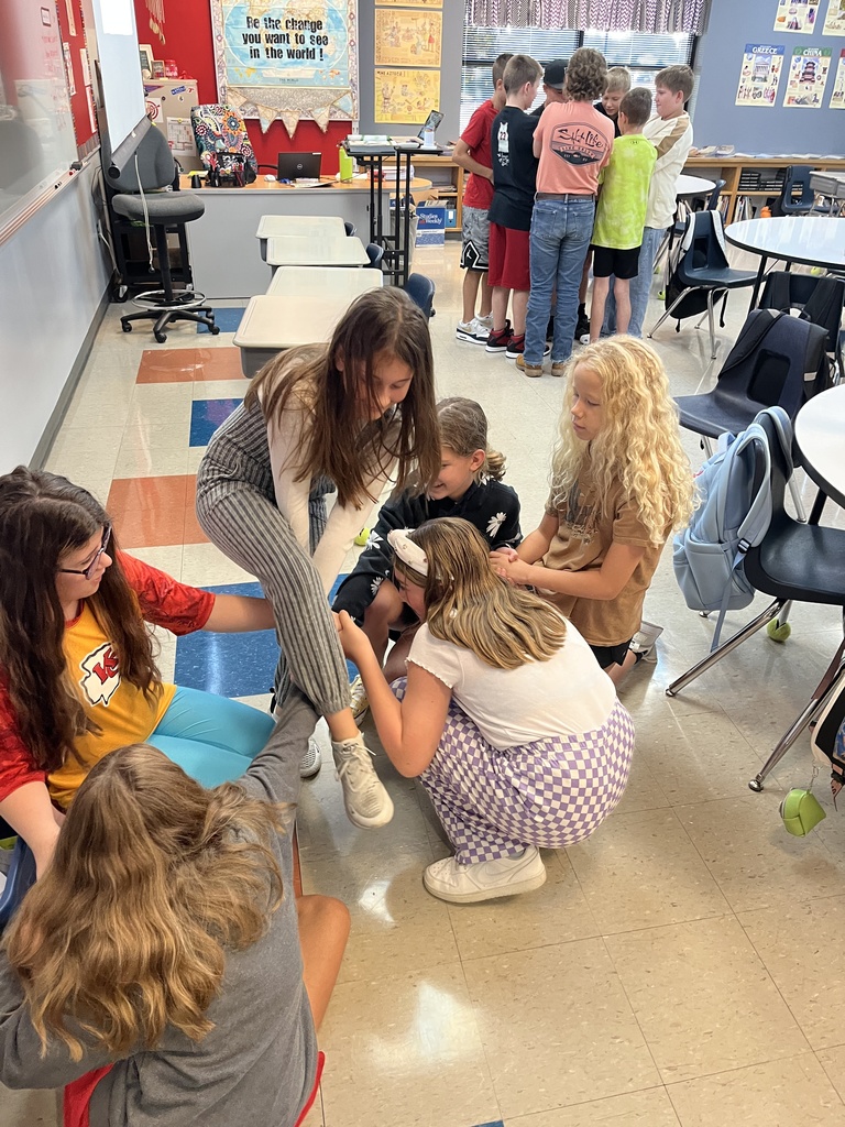 middle school boys and girls untangling themselves from a human knot