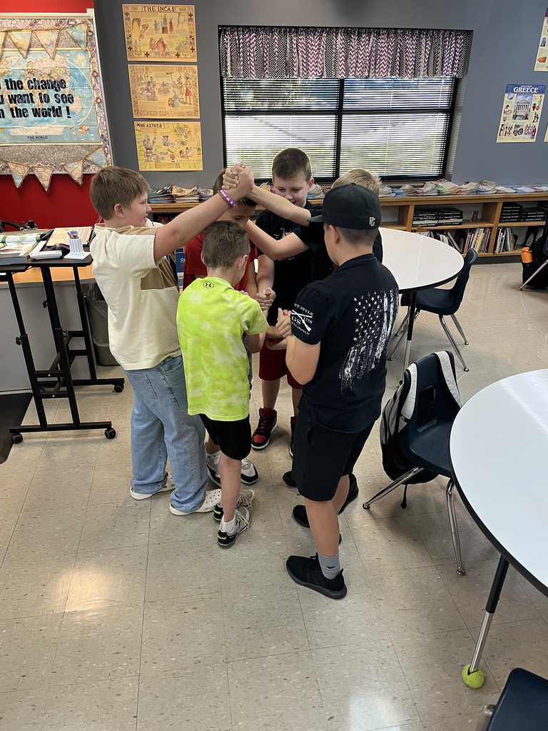 middle school boys and girls untangling themselves from a human knot