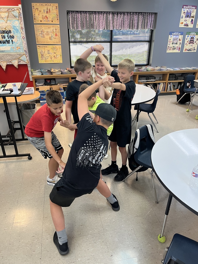 middle school boys and girls untangling themselves from a human knot