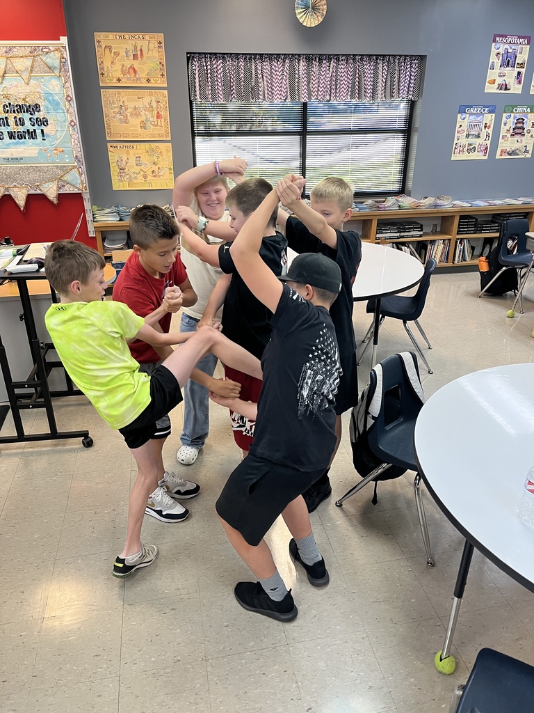 middle school boys and girls untangling themselves from a human knot