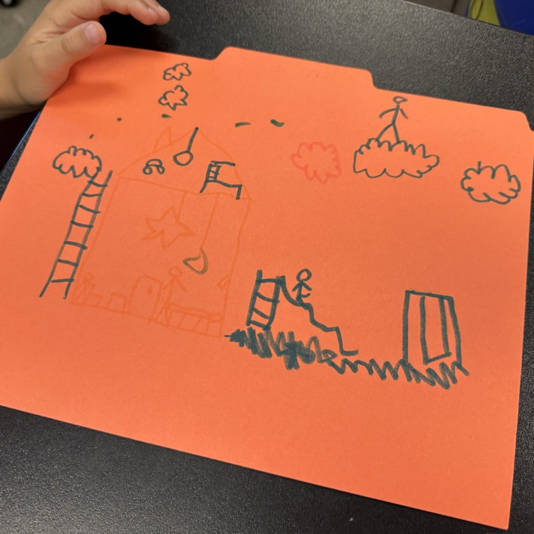 first graders drawing on folder