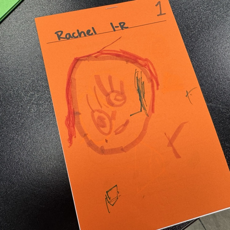 first graders drawing on sketchbook covers 