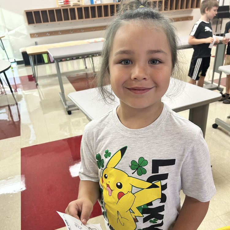 Students are playing quiz quiz trade and asking each other fun questions. 