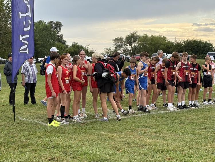 coach Bond talking to the team at the start line.